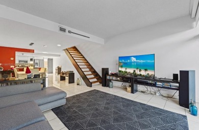 Stunning 3-level with breathtaking golf course and water views on Country Club of Miami in Florida - for sale on GolfHomes.com, golf home, golf lot