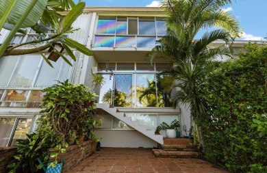 Stunning 3-level with breathtaking golf course and water views on Country Club of Miami in Florida - for sale on GolfHomes.com, golf home, golf lot