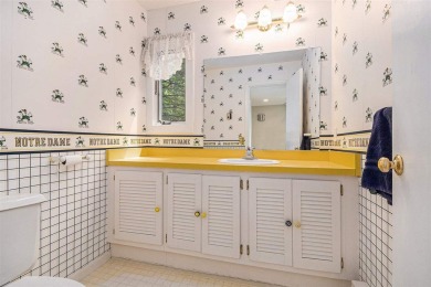 Nestled on a serene, wooded lot and backing up to protected on Birchwood Farms Golf and Country Club in Michigan - for sale on GolfHomes.com, golf home, golf lot