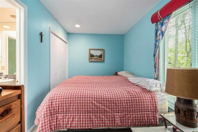Nestled on a serene, wooded lot and backing up to protected on Birchwood Farms Golf and Country Club in Michigan - for sale on GolfHomes.com, golf home, golf lot