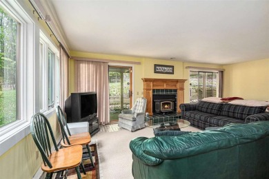 Nestled on a serene, wooded lot and backing up to protected on Birchwood Farms Golf and Country Club in Michigan - for sale on GolfHomes.com, golf home, golf lot