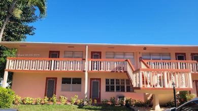 Great clean first floor unit in a quiet building with ample on Hillsboro Pines Golf in Florida - for sale on GolfHomes.com, golf home, golf lot