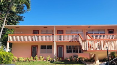 Great clean first floor unit in a quiet building with ample on Hillsboro Pines Golf in Florida - for sale on GolfHomes.com, golf home, golf lot