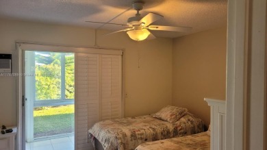 Great clean first floor unit in a quiet building with ample on Hillsboro Pines Golf in Florida - for sale on GolfHomes.com, golf home, golf lot