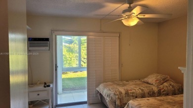 Great clean first floor unit in a quiet building with ample on Hillsboro Pines Golf in Florida - for sale on GolfHomes.com, golf home, golf lot