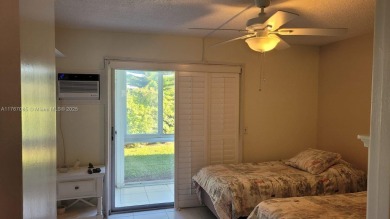 Great clean first floor unit in a quiet building with ample on Hillsboro Pines Golf in Florida - for sale on GolfHomes.com, golf home, golf lot