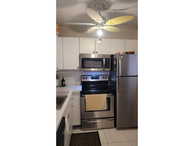 Great clean first floor unit in a quiet building with ample on Hillsboro Pines Golf in Florida - for sale on GolfHomes.com, golf home, golf lot