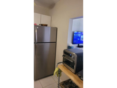 Great clean first floor unit in a quiet building with ample on Hillsboro Pines Golf in Florida - for sale on GolfHomes.com, golf home, golf lot