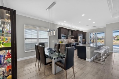 Discover refined lakefront living at 28732 Montecristo Loop in on Palmira Golf and Country Club in Florida - for sale on GolfHomes.com, golf home, golf lot