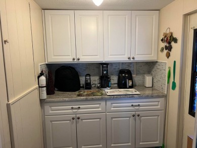 This lovely, manufactured home is on leased land and located in on Pine Lakes Country Club in Florida - for sale on GolfHomes.com, golf home, golf lot