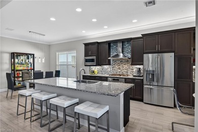 Discover refined lakefront living at 28732 Montecristo Loop in on Palmira Golf and Country Club in Florida - for sale on GolfHomes.com, golf home, golf lot