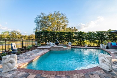 Welcome to 7409 Gathering Ct, a fully remodeled Mediterranean on  in Florida - for sale on GolfHomes.com, golf home, golf lot