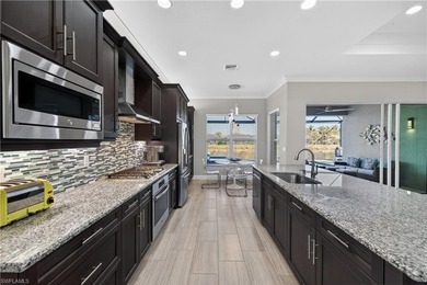 Discover refined lakefront living at 28732 Montecristo Loop in on Palmira Golf and Country Club in Florida - for sale on GolfHomes.com, golf home, golf lot