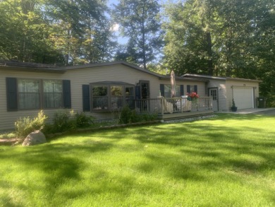 You'll enjoy the quality, 6' walls and workmanship of the lovely on Lost Lake Woods Club in Michigan - for sale on GolfHomes.com, golf home, golf lot