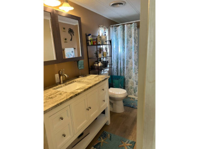 This lovely, manufactured home is on leased land and located in on Pine Lakes Country Club in Florida - for sale on GolfHomes.com, golf home, golf lot