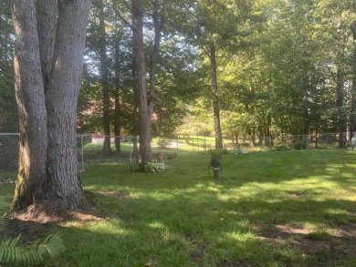 You'll enjoy the quality, 6' walls and workmanship of the lovely on Lost Lake Woods Club in Michigan - for sale on GolfHomes.com, golf home, golf lot