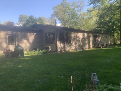 You'll enjoy the quality, 6' walls and workmanship of the lovely on Lost Lake Woods Club in Michigan - for sale on GolfHomes.com, golf home, golf lot