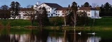You'll enjoy the quality, 6' walls and workmanship of the lovely on Lost Lake Woods Club in Michigan - for sale on GolfHomes.com, golf home, golf lot