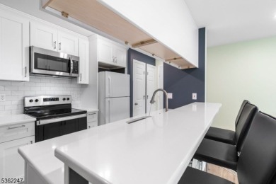 Flooded with natural light, this bright and airy end-unit condo on Quail Brook Golf Course in New Jersey - for sale on GolfHomes.com, golf home, golf lot