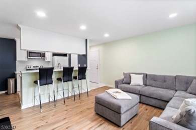 Flooded with natural light, this bright and airy end-unit condo on Quail Brook Golf Course in New Jersey - for sale on GolfHomes.com, golf home, golf lot
