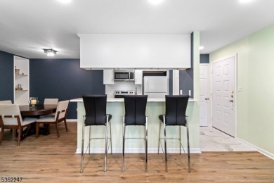 Flooded with natural light, this bright and airy end-unit condo on Quail Brook Golf Course in New Jersey - for sale on GolfHomes.com, golf home, golf lot
