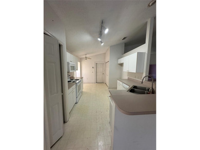 Discover the tranquility you've been searching for in this on Oakwood Golf Club in Florida - for sale on GolfHomes.com, golf home, golf lot