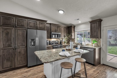 Perfectly positioned along the par-5 10th fairway, this darling on Sky Mountain Golf Course in Utah - for sale on GolfHomes.com, golf home, golf lot