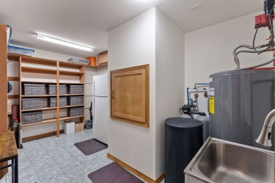 If you want beautiful Swan Mountain views from almost every room on Eagle Bend Golf Course in Montana - for sale on GolfHomes.com, golf home, golf lot