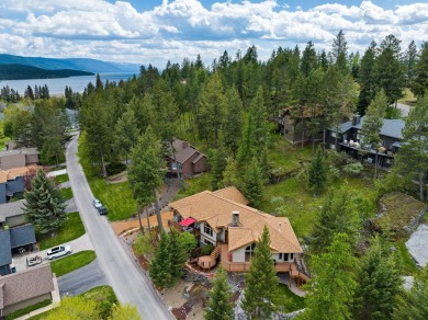 If you want beautiful Swan Mountain views from almost every room on Eagle Bend Golf Course in Montana - for sale on GolfHomes.com, golf home, golf lot