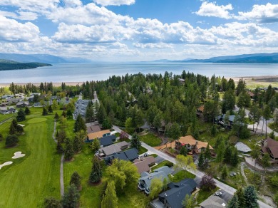 If you want beautiful Swan Mountain views from almost every room on Eagle Bend Golf Course in Montana - for sale on GolfHomes.com, golf home, golf lot