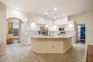 Spacious and well-maintained, this 5-bedroom, 3-bath POOL home on Remington Golf Club in Florida - for sale on GolfHomes.com, golf home, golf lot