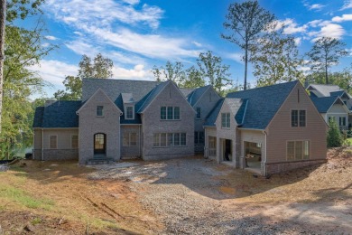 Nestled behind the gates of Reynolds, this stunning new custom on Reynolds Lake Oconee - The Oconee in Georgia - for sale on GolfHomes.com, golf home, golf lot