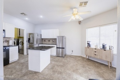 Located in Johnson Ranch community, this stunning two-story home on The Golf Club At Johnson Ranch in Arizona - for sale on GolfHomes.com, golf home, golf lot