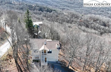 This well kept home has it all...HUGE Views, Garage, Paved Road on Beech Mountain Club in North Carolina - for sale on GolfHomes.com, golf home, golf lot