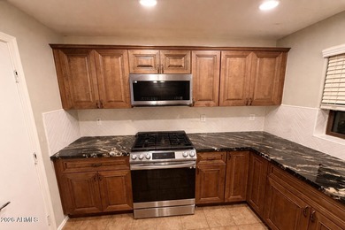 Opportunity awaits in this 3-bedroom, 2.5-bath home featuring a on Poston Butte Golf Club in Arizona - for sale on GolfHomes.com, golf home, golf lot