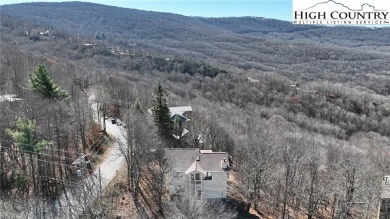 This well kept home has it all...HUGE Views, Garage, Paved Road on Beech Mountain Club in North Carolina - for sale on GolfHomes.com, golf home, golf lot