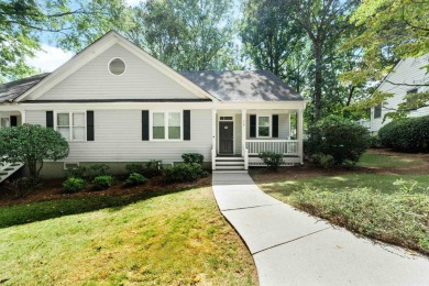 Welcome to this charming cottage nestled in the sought-after on Great Waters Course At Reynolds Plantation in Georgia - for sale on GolfHomes.com, golf home, golf lot