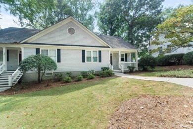 Welcome to this charming cottage nestled in the sought-after on Great Waters Course At Reynolds Plantation in Georgia - for sale on GolfHomes.com, golf home, golf lot