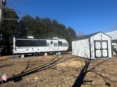 This is a rare treat.  Brand New 2025 Wildwood camper.  Just on Captains Cove Golf and Yacht Club in Virginia - for sale on GolfHomes.com, golf home, golf lot