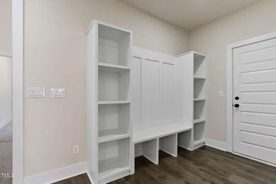 MODERN LUXURY LIVING AT LAKE ROYALE! This custom-built 3BR/3BA on River Golf and County Club at Lake Royale in North Carolina - for sale on GolfHomes.com, golf home, golf lot