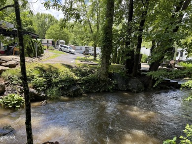 VERY RARE VACANT CREEK lot in the sought after Outdoor Resorts on Bent Creek Golf Course in Tennessee - for sale on GolfHomes.com, golf home, golf lot