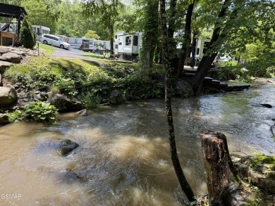 VERY RARE VACANT CREEK lot in the sought after Outdoor Resorts on Bent Creek Golf Course in Tennessee - for sale on GolfHomes.com, golf home, golf lot