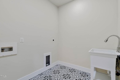 MODERN LUXURY LIVING AT LAKE ROYALE! This custom-built 3BR/3BA on River Golf and County Club at Lake Royale in North Carolina - for sale on GolfHomes.com, golf home, golf lot