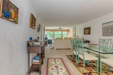 Experience serene living in this beautifully maintained on Village Golf Club in Florida - for sale on GolfHomes.com, golf home, golf lot