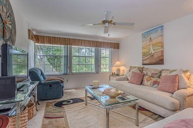 Experience serene living in this beautifully maintained on Village Golf Club in Florida - for sale on GolfHomes.com, golf home, golf lot