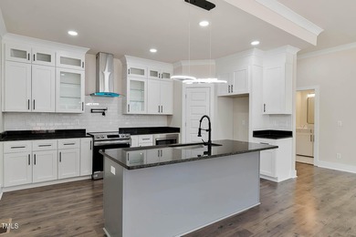 MODERN LUXURY LIVING AT LAKE ROYALE! This custom-built 3BR/3BA on River Golf and County Club at Lake Royale in North Carolina - for sale on GolfHomes.com, golf home, golf lot