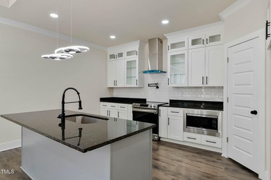 MODERN LUXURY LIVING AT LAKE ROYALE! This custom-built 3BR/3BA on River Golf and County Club at Lake Royale in North Carolina - for sale on GolfHomes.com, golf home, golf lot