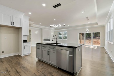 MODERN LUXURY LIVING AT LAKE ROYALE! This custom-built 3BR/3BA on River Golf and County Club at Lake Royale in North Carolina - for sale on GolfHomes.com, golf home, golf lot