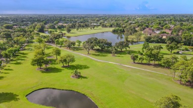 Experience serene living in this beautifully maintained on Village Golf Club in Florida - for sale on GolfHomes.com, golf home, golf lot