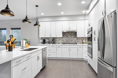 Welcome to this stunning contemporary walk-out rancher nestled on  in  - for sale on GolfHomes.com, golf home, golf lot